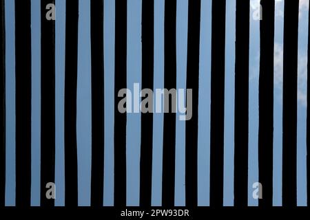 Wooden slat ceiling with sky on the background Stock Photo