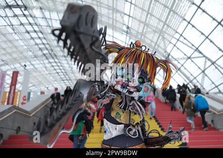 Leipzig, Germany. 29th Apr, 2023. A performer of the character Scrap Baby stands in the glass hall of the Neue Messe. Traditionally, the Leipzig Book Fair is also a meeting place for coyplayers and manga fans. Credit: Sebastian Willnow/dpa/Alamy Live News Stock Photo