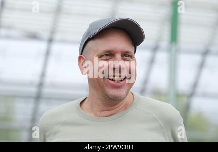 Leipzig, Germany. 29th Apr, 2023. Ralph Ruthe, comic artist and author, stands in the glass hall of the Neue Messe. After a forced break of three years, the book fair will take place again from April 27 to 30. Credit: Sebastian Willnow/dpa/Alamy Live News Stock Photo