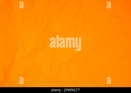 Orange color crumpled paper texture background Stock Photo