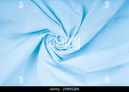 Light blue crumpled fabric texture background. Close up. Stock Photo