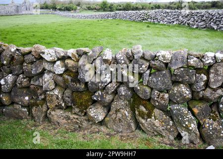 dry stone walls at Kilmacduagh monastery county galway republic of ireland Stock Photo