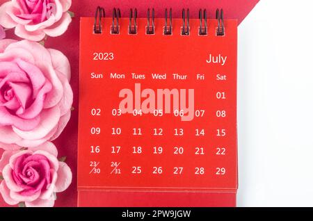 Red July 2023 Monthly desk calendar for 2023 year with pink rose. Stock Photo