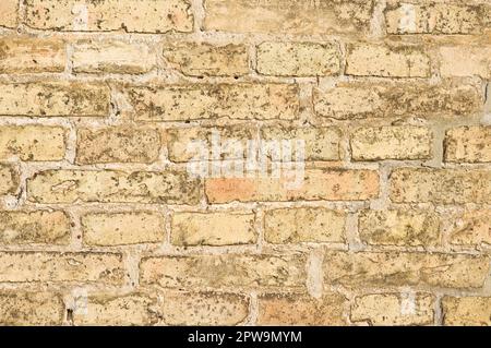 Yellow stone brick wall pattern background Stock Photo