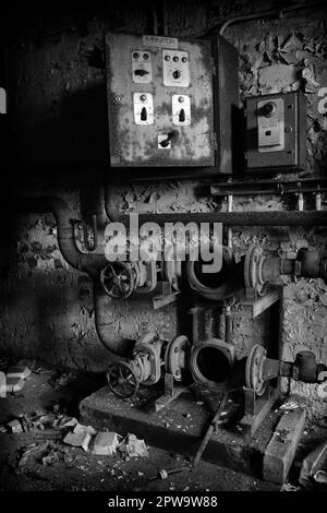 An old electrical panel in the basement of the abandoned Easington Colliery School, now demolished. Stock Photo