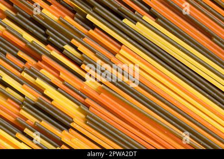 Spaghetti tricolore close up full frame as background Stock Photo