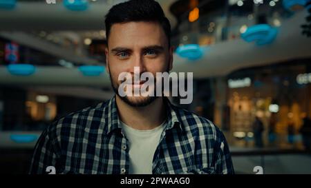 Confident bearded young hispanic caucasian ethnicity millennial 30s man student businessman stylish customer shopper leader office worker posing in Stock Photo