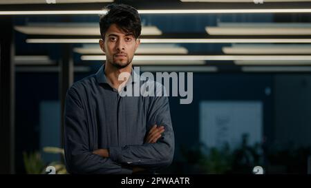 Male portrait strong man arabian indian ethnic male boss leader professional entrepreneur banker employee worker confident posing at modern office Stock Photo