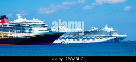Norwegin Dawn and Disney Fantasy cruise ships dock in Oranjestad Aruba Stock Photo