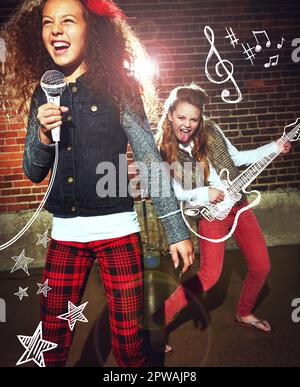 Rock on. two girls singing and playing rock music on imaginary instruments. Stock Photo