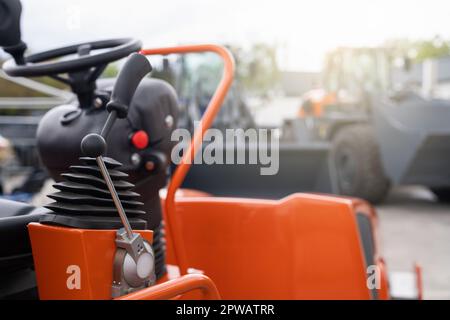 Steering wheel and joystick to drive a tractor. High quality photo Stock Photo