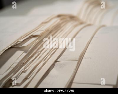 Paper cash receipts in a stack of tickets. Close-up of cash receipts. Stock Photo
