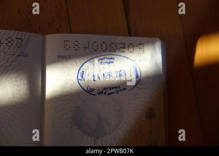 Cairo, Egypt. 29th Apr, 2023. The departure stamp is seen on a Sudanese passport belonging to a woman who crossed into Egypt through Arqeen border crossing to escape the conflict in her home country. Credit: Lobna Tarek/dpa/Alamy Live News Stock Photo