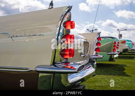 A row of classic DeSoto automobile tail fins from 1957, 1958, 1960 and 1955 on display at a classic car show. Stock Photo
