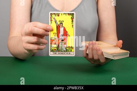 Lodz Poland April 15 2023 Magician arcana, hand holding showing tarot card during divination. Stock Photo