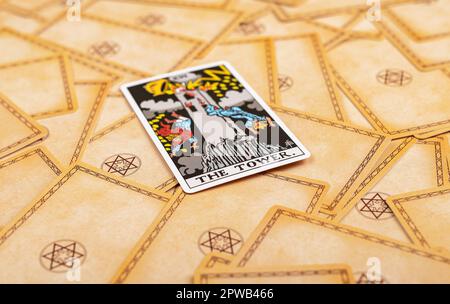 Lodz Poland April 15 2023 The Tower, major arcana on tarot cards deck background. Taro divination concept. Stock Photo