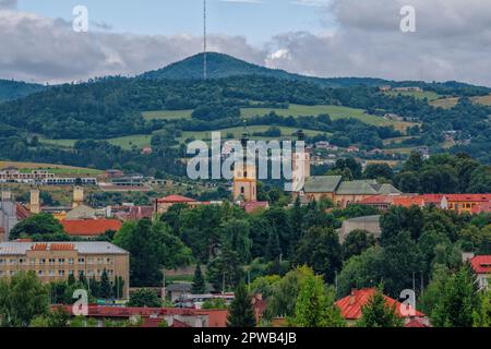 Banska Bystrica, Slovakia - August 17, 2021: aerial summer cityscape - colorful buildings, green hills on the horizon and blue sky Stock Photo