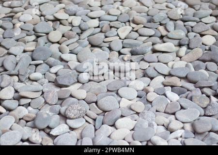Small stones texture background, white background pebbles, simplicity. Stock Photo
