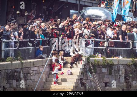 Brixham, UK. 29th Apr, 2023. Thousands of people, most dressed as pirates, enjoy the Brixham Pirate Festival on the Devon coast. Credit: Thomas Faull/Alamy Live News Stock Photo