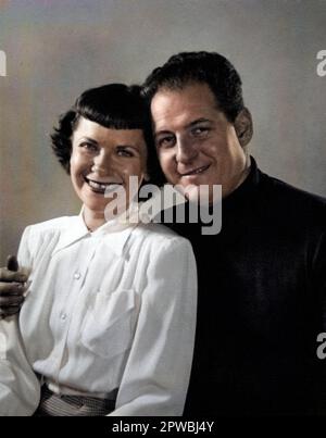 Archival photograph of a happy couple posing for a portrait, circa 1940s-1950s. Stock Photo