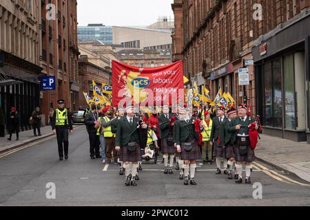 Glasgow, Scotland, UK. 29th Apr, 2023. Members of the PCS Union lead the Glasgow Trades Union Council May Day march from George Square for a rally in Queen's Park. Credit: Richard Gass/Alamy Live News Stock Photo