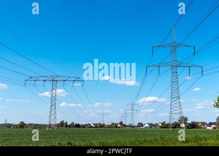 Overhead power lines in rural Germany Stock Photo