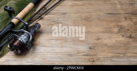 Fishing tackle on wooden background Stock Photo - Alamy