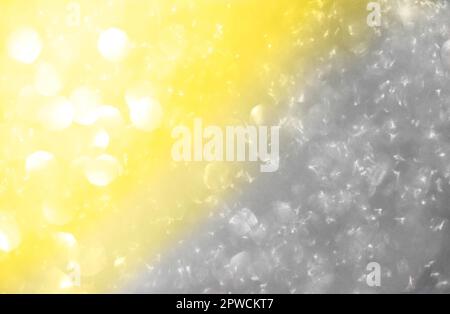 Abstract background of bright spots of lights shining with illuminating yellow and ultimate gray colors Stock Photo