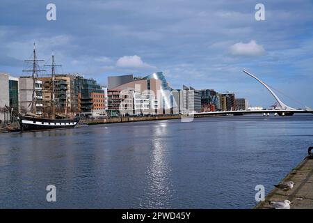 View of the River Liffey in Dublin with modern buildings near the restored docklands area Stock Photo