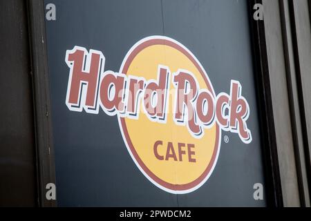 lyon , Aura France - 04 20 2023 : Hard Rock Cafe sign text on facade wall entrance with brand logo signboard Stock Photo