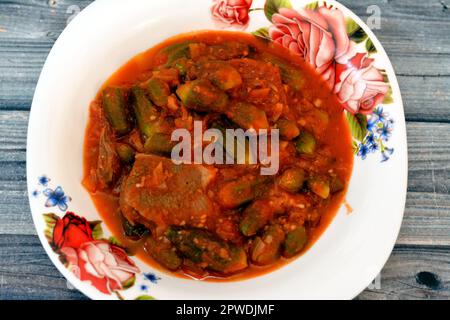 Okra cooked with beef meat pieces and tomato sauce, Bamia, bamya or Okro is Abelmoschus esculentus, known in many English-speaking countries as ladies Stock Photo