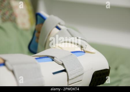 Concept of bandaging and treating an ankle injury at home Stock Photo