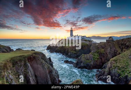 Sunrise over the lighthouse at Fanad Head in County Donegal in Ireland Stock Photo