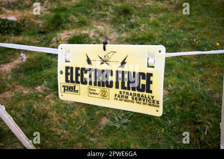 livestock electric fence warning sign county clare republic of ireland Stock Photo