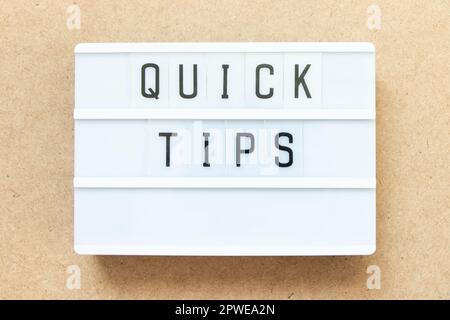 Lightbox with word quick tips on wood background Stock Photo