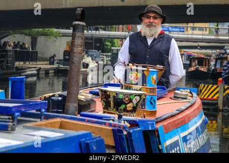 London, UK, 30th April 2023. Peter, a volunteer on the 'Pisces' dressed up in a traditional boating outfit, represents the Hillingdon Narrowboat Association, a charity that takes disadvantages people on boat trips. Narrowboats, barges and canal boats once again take part in the IWA Canalway Cavalcade festival in Little Venice Organised by the Inland Waterways Association (IWA), IWA Canalway Cavalcade has its 40th anniversary this year, celebrating boat life on the waterways with a boat pageant, music, stalls and family entertainment along the Grand Union Canal. Stock Photo