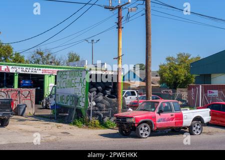 NEW ORLEANS, LA, USA - MARCH 5, 2023: Busy urban auto repair and sales shop on Claiborne Avenue Stock Photo