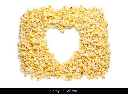 Heart made of crispy popcorn on white background Stock Photo