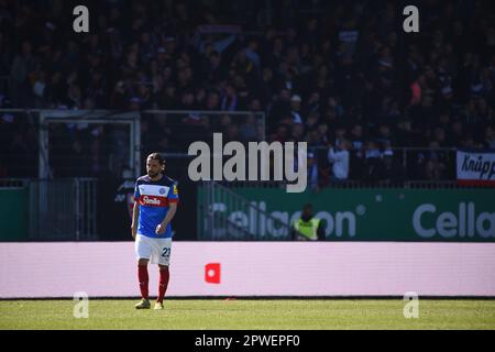 30 April 2023, Schleswig-Holstein, Kiel: Soccer: 2nd Bundesliga, Holstein Kiel - Darmstadt 98, Matchday 30, Holstein Stadium. Kiel's Julian Korb walks across the pitch after the 3-0 defeat. Photo: Gregor Fischer/dpa - IMPORTANT NOTE: In accordance with the requirements of the DFL Deutsche Fußball Liga and the DFB Deutscher Fußball-Bund, it is prohibited to use or have used photographs taken in the stadium and/or of the match in the form of sequence pictures and/or video-like photo series. Stock Photo