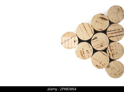 Corks in the shape of a triangle with dark shadows isolated on a white background. Stock Photo