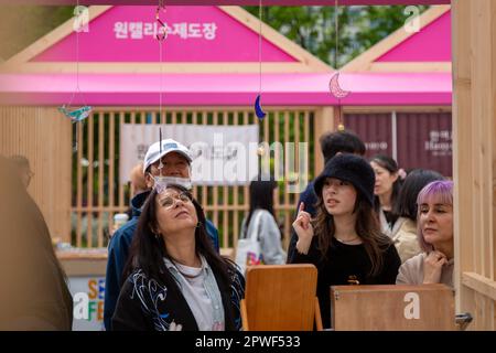 Seoul, South Korea. 30th Apr, 2023. Visitors look at wind chimes at the Gwanghwamun Square during the Seoul Festa 2023 in Seoul, South Korea, April 30, 2023. The eight-day Seoul Festa 2023 opened on Sunday featuring entertaining programs for both domestic and international tourists to 'feel the real Seoul.' Credit: Wang Yiliang/Xinhua/Alamy Live News Stock Photo
