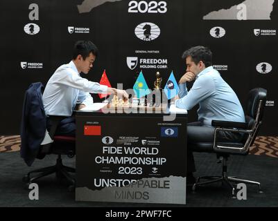 Astana, Kazakhstan. 30th Apr, 2023. China's Ding Liren (L) and Russia's Ian  Nepomniachtchi compete during their