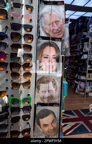 London, UK.  30 April 2023.  Royal memorabilia, including a King Charles, Princess of Wales and Prince Harry facemask, seen in the window of a souvenir shop in Paddington ahead of the coronation of King Charles III on 6 May.  Credit: Stephen Chung / Alamy Live News Stock Photo