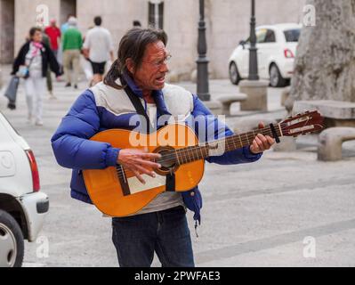Flamenco guitarist playing for cafe customers in old town Palma Majorca Stock Photo