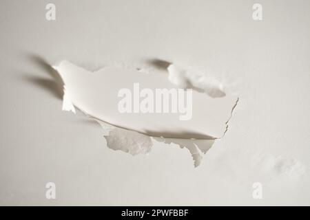 The paint is peeling off the plastered ceiling. Old paint peeling off the ceiling Stock Photo