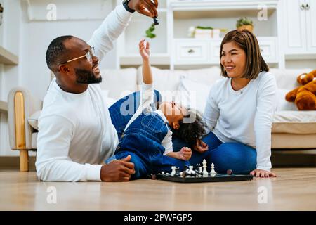 Happy family spending time and having activities together at home Stock Photo