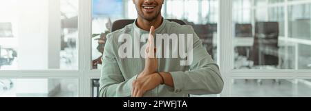 African businessman using sign language while talking online with client sitting in office Stock Photo