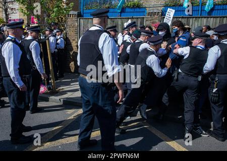 London, UK. 29th April, 2023. Metropolitan Police officers push back anti-fascists and LGBTIQA+ people opposing a small protest by supporters of Turning Point UK against a Drag Queen Story Time event at the Honor Oak pub in Forest Hill. Turning Point UK, as well as far-right groups such as Patriotic Alternative, have tried to prevent previous Drag Queen Story Time events from taking place. The counter-protest was organised by Stand Up To Racism, Lewisham National Education Union and LGBTIQA+ groups. Credit: Mark Kerrison/Alamy Live News Stock Photo