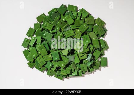 Many vintage green ceramic capacitors,close up, electronics industrial background. Old radio components from the times of the Soviet Union Stock Photo