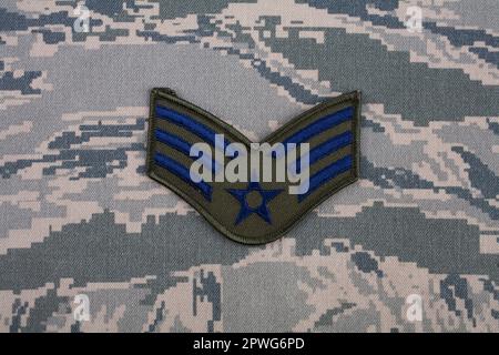 August 31, 2020. US AIR FORCE Senior Airman rank patch on digital tiger-stripe pattern Airman Battle Uniform (ABU) Stock Photo